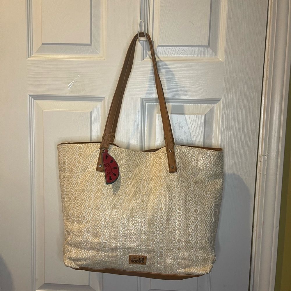 Tyler Rodman beige woven large tote with tan faux leather trim and straps .